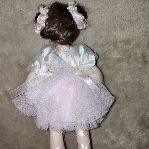 Porcelain doll like new, height 14.5 cm