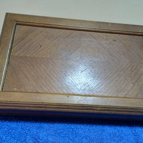 Wooden jewelry box used with velvet-lined compartments