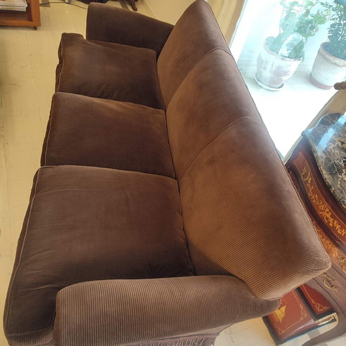 Handmade sofa used with brown velvet upholstery and walnut legs