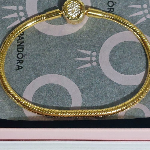 Pandora bracelet size 20 cm, gold plated with crown clasp