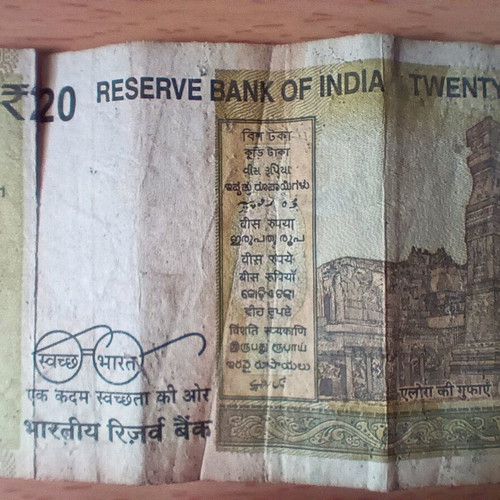 Indian 20 Rupees banknote used with tear