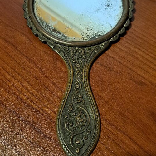 Brass hand mirror used with embossed peacock decoration