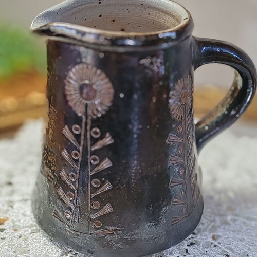 Retro ceramic milk jug with embossed flowers