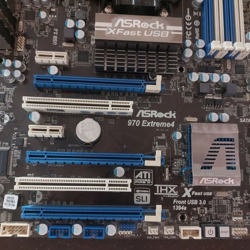 AsRock 970 Extreme4 AM3+ motherboard used, functional with updated BIOS