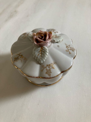 Vintage sugar bowl or jewelry box used with small rose and gold decorations