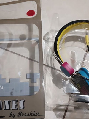 Modern wired colorful headphones by Bershka used with defect