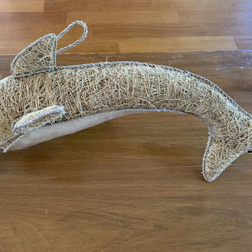 Handmade decorative dolphin made of grass