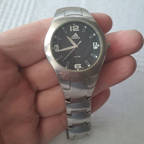 Adidas watch used with black and silver bracelet