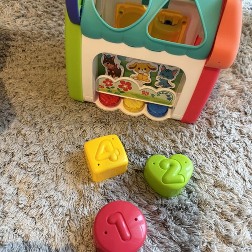 Baby toys set like new with shape matching eggs, house, and rattle gift