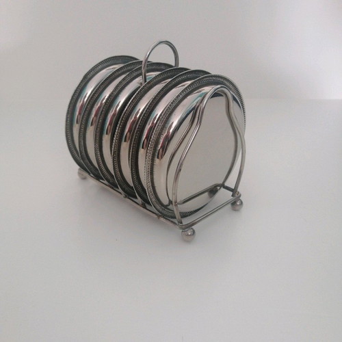 Vintage silver coaster set with elegant stand, like new