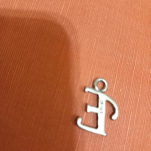 Silver pendant with letter E used