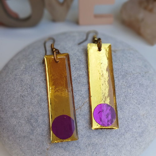 Handmade earrings with purple and gold resin