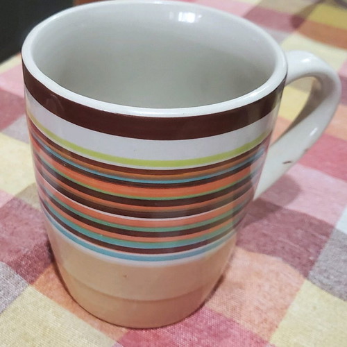 Coffee mugs used, set of 4 with designs and Nava brand