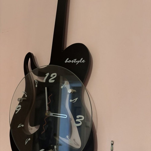 Guitar-shaped wall clock like new