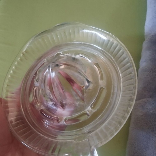 Glass lemon squeezer used