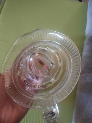 Glass lemon squeezer used