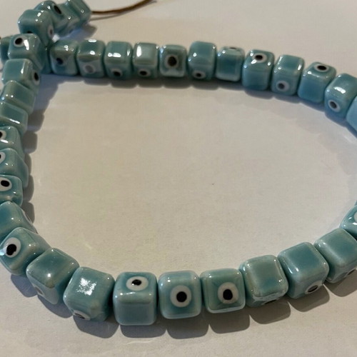 Enamelled ceramic cube-shaped evil eye beads, new, turquoise