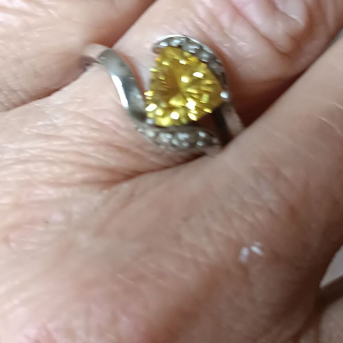 Silver ring like new with yellow stone, adjustable