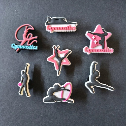 Crocs charms gymnastics set like new, pink multicolor