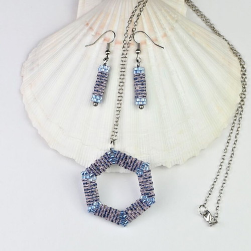 Custom-made jewelry set in light blue tones with hexagonal pendant