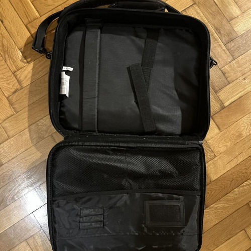 Black laptop bag with shoulder strap and pockets