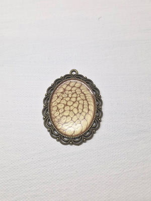 Oval vintage pendant in excellent condition orange and silver