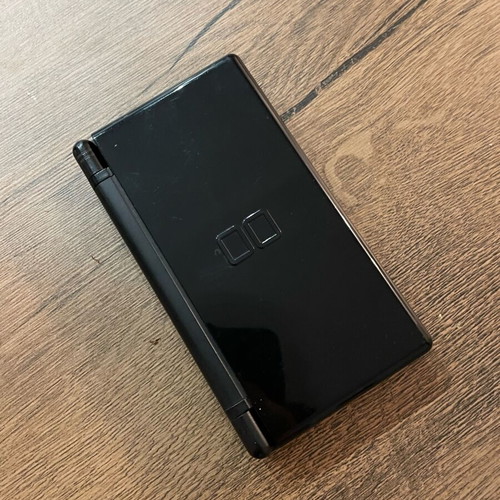 Nintendo DS Lite used, black with cartridge and original charger
