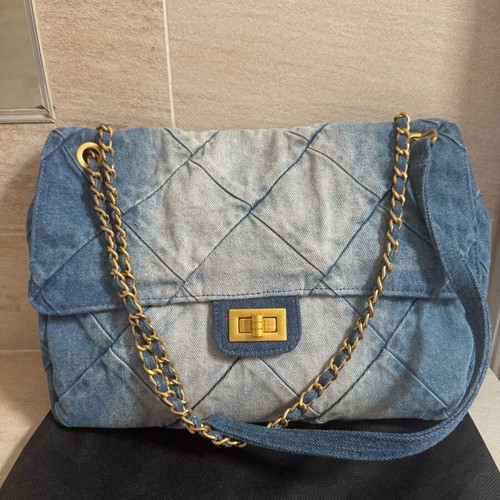 Denim shoulder bag like new with bronze details