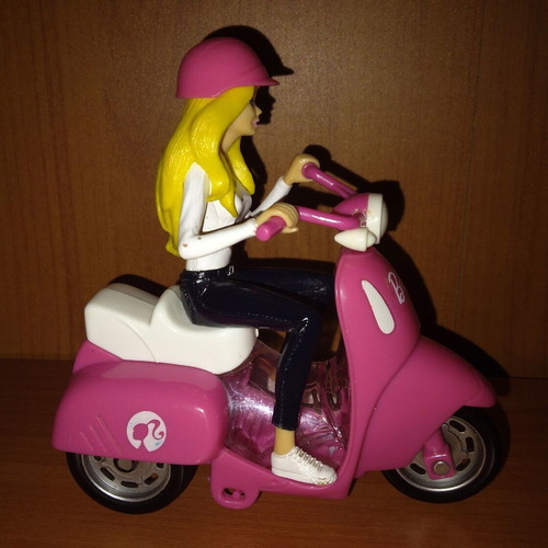 Barbie figure on motorcycle used with motion