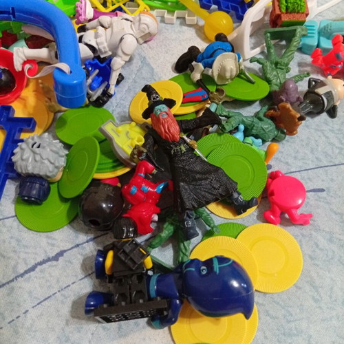 Toy pack with action figures, army men, and construction blocks like new