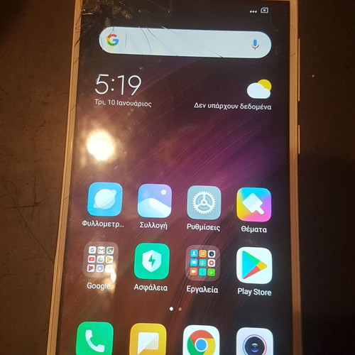 Xiaomi Redmi 4X smartphone with cracked screen, gold