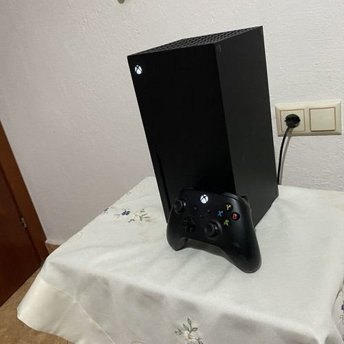 Xbox Series X console used with black wireless controller