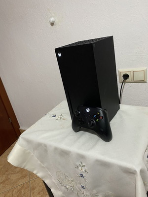 Xbox Series X console used with black wireless controller