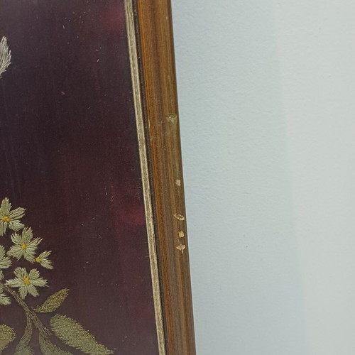 Embroidered textile painting used with silver and gold thread on velvet