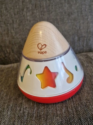 Musical toy new, wind-up and spins while playing music