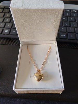 Gold necklace with large puffy heart pendant like new