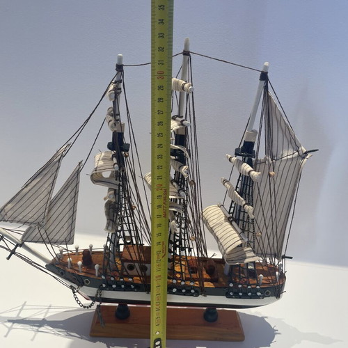 Vintage wooden decorative ship like new with striped sails and wooden base