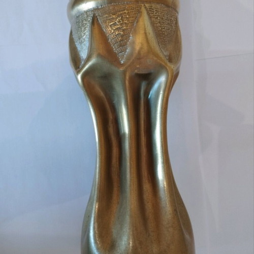 Bronze carved shell casing like new