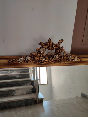 Carved mirror in gold color like new