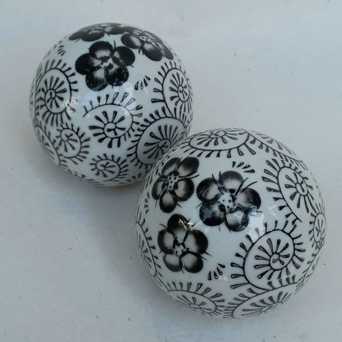 Vintage decorative porcelain spheres set like new with floral and geometric designs