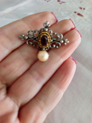 Vintage ornate brooch with purple stone and pearl used