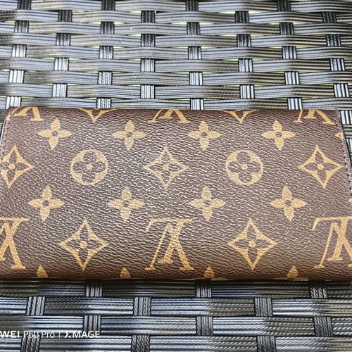 Louis Vuitton wallet used, authentic with visible marks inside