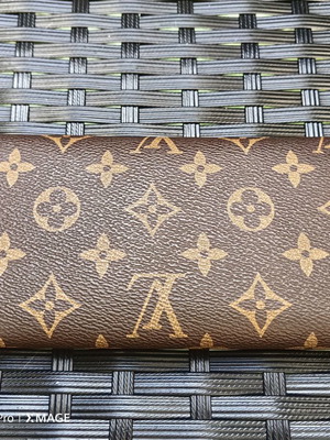 Louis Vuitton wallet used, authentic with visible marks inside