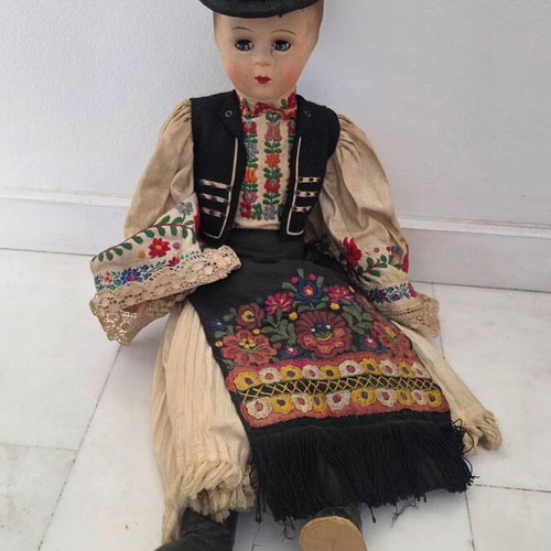 Traditional doll used with embroidered costume and hat