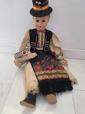 Traditional doll used with embroidered costume and hat