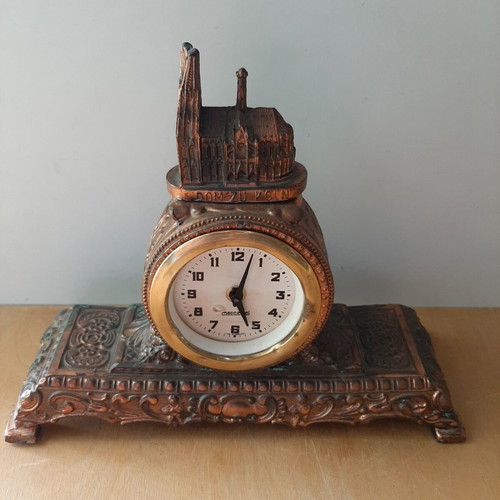 Copper German wind-up clock used with cathedral motif