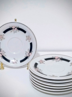 Vintage porcelain saucers set of 7 with pink flowers and black motif like new