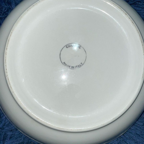 Ceramic serving dish used with artichoke design