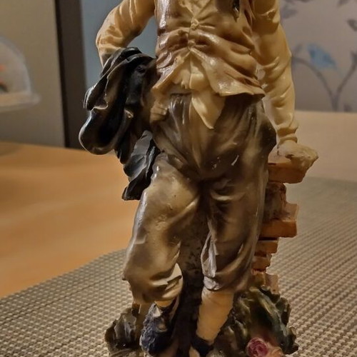 Decorative vintage figurine on wooden base like new