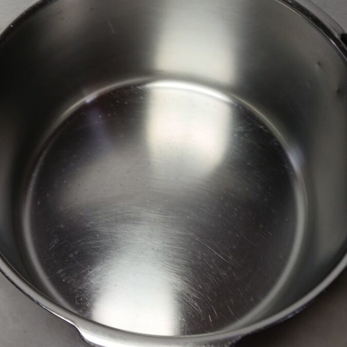 Pressure cooker used, lid needs repair, missing handle, small crack